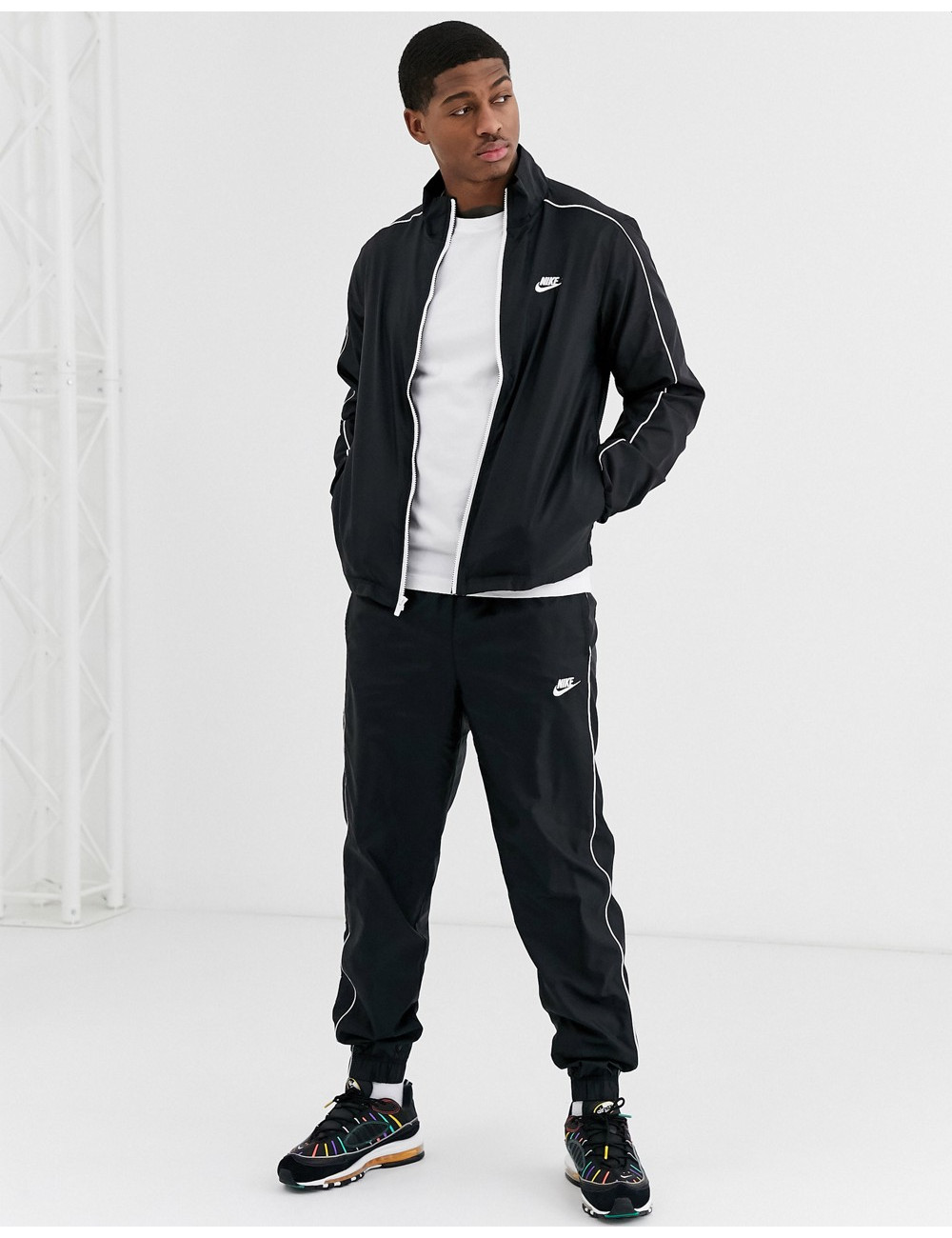 Nike woven tracksuit set in...