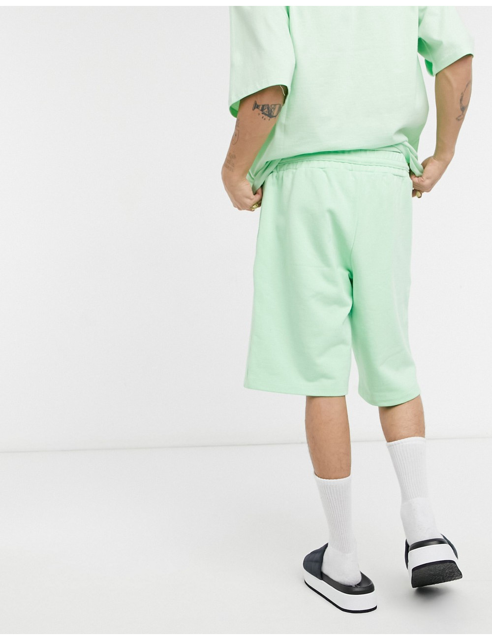 COLLUSION shorts in green...