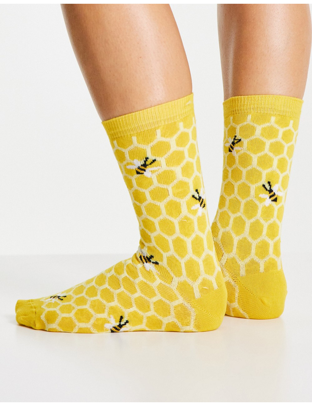 Accessorize socks with bee...