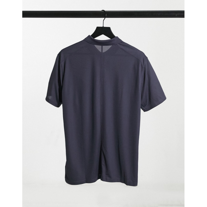 Nike Solid polo in black